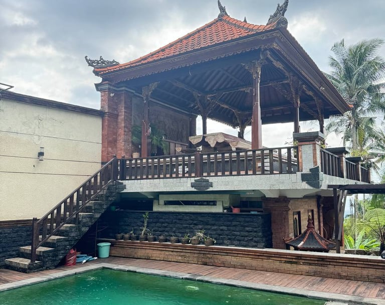 Strong antique teak columns supporting Joglo house structure ensuring long lasting durability and aesthetic value