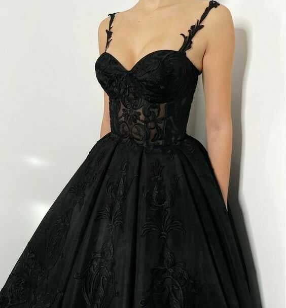 a woman in a black dress with a black dress