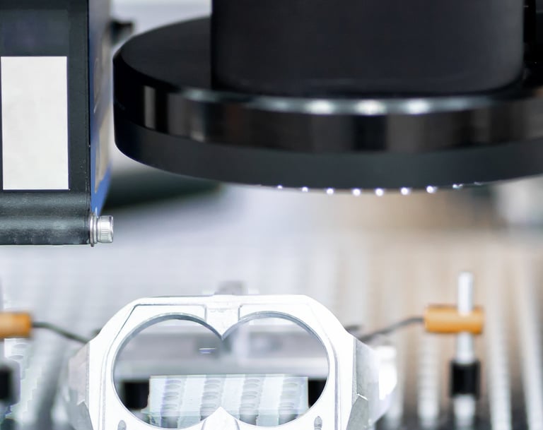 Optical CMM inspecting a fixtured component using vision and laser distance sensors. 