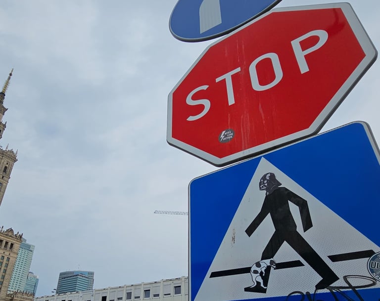 a stop sign with a pedestrian crossing sign