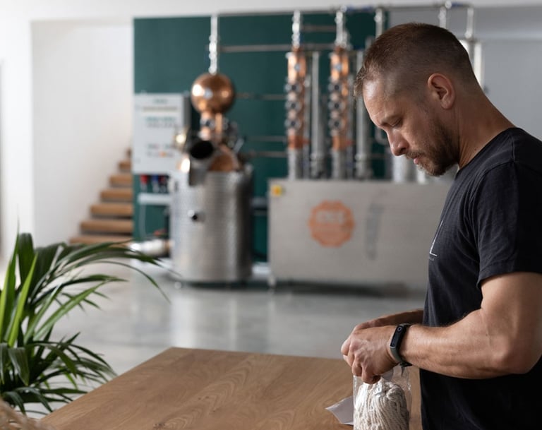 master distiller is sampling botanicals