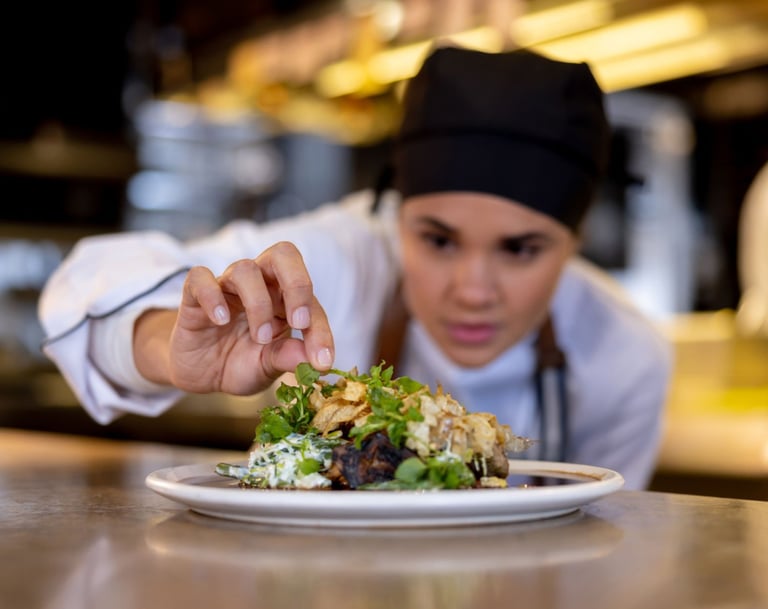 a chef is preparing to serve a meal