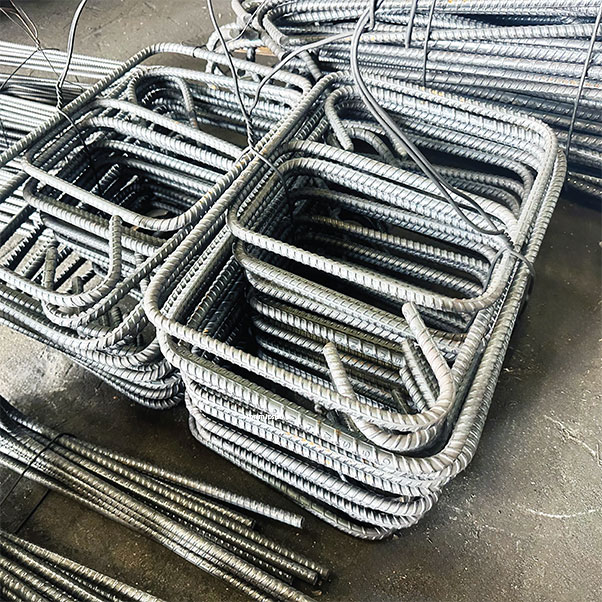 Stacks of precision machine-bent rebar stirrups ready for delivery
