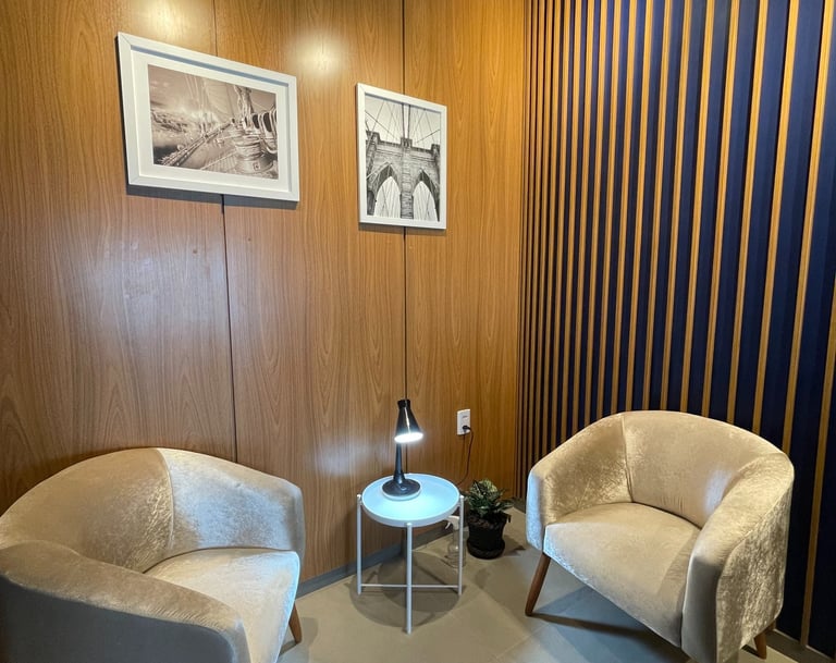 a living room with a chair and a table fairtrade office