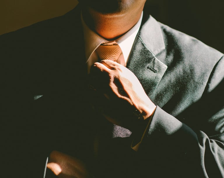 Executive is fixing his tie