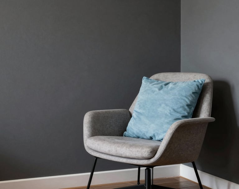 Interior photography of a minimalist Brazilian apartment, showing a corner with a dark gray wall and a sophisticated designer chair, a single baby blue cushion providing a pop of color, soft natural lighting.