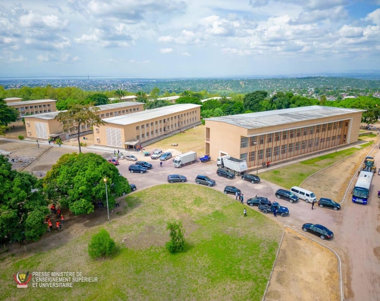 a large building with a lot of cars parked in front of it
