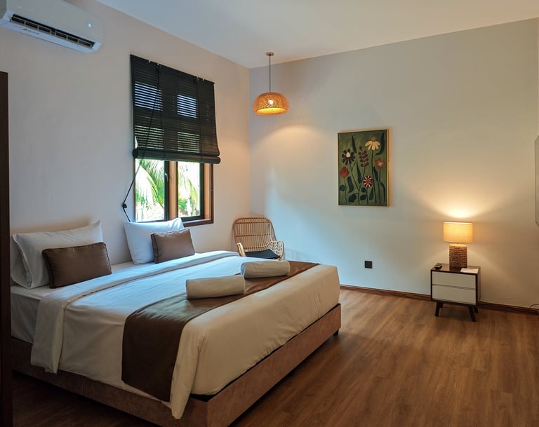 a bedroom with a bed and a chair