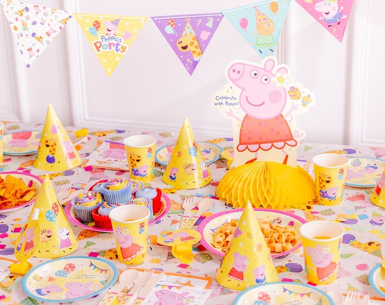 a table with a pep pep the pig party hat