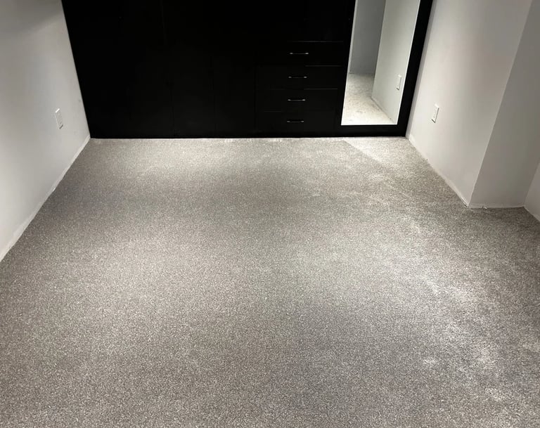Grey carpet installed wall-to-wall in warm and soft basement space in Tillsonburg Ontario residential home