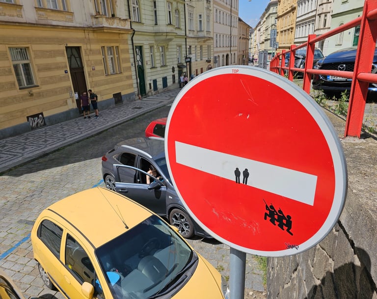 a red and white sign with a red and white sign that says no parking