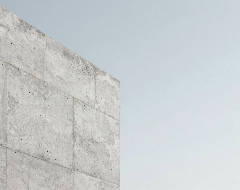 A close-up detail of architectural concrete against a clear, pale sky. The texture of the stone is highly detailed. Minimalist and refined mood, using #F5F7FA and #D0D5DB color palette.
