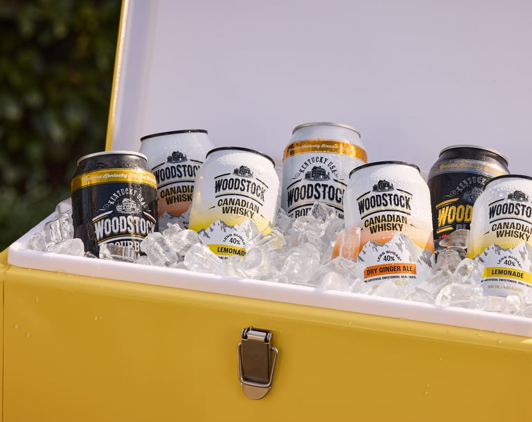 Product photography - a cooler box with cans of woodstock whisky
