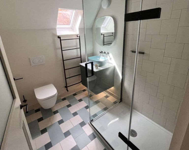 Bathroom with modern bathtub and vanity unit installed by PBP Services in Evesham