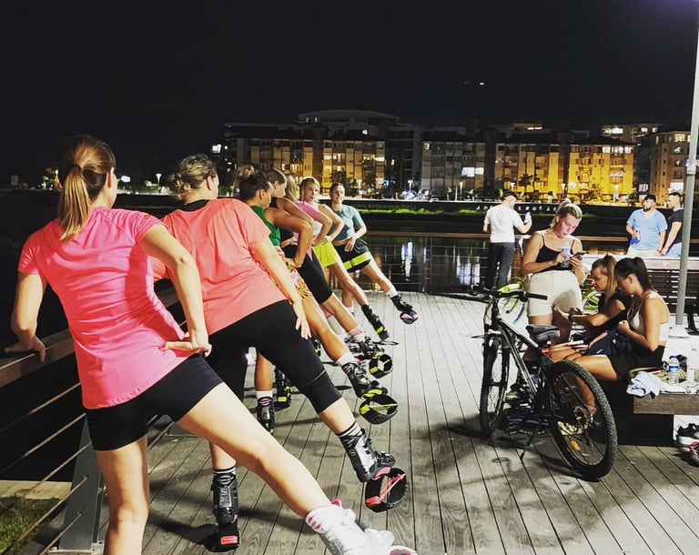 a group of women kangoo jump in KLCC