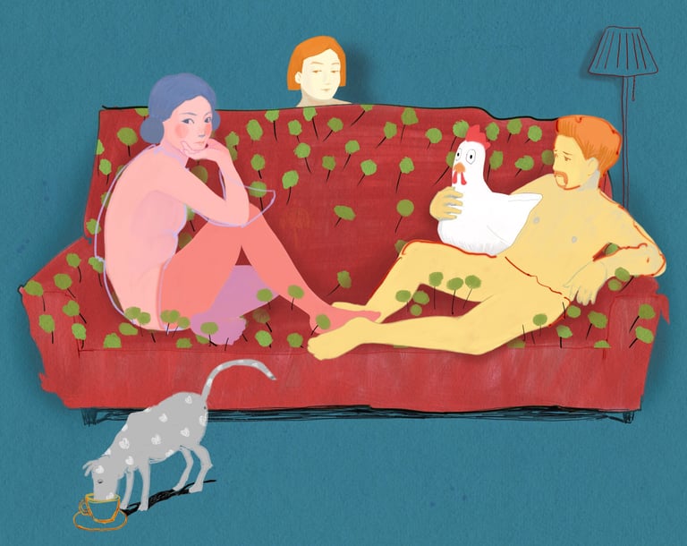 a woman sitting on a couch with a dog and a cat