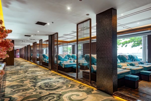 a restaurant with a long row of seating seating