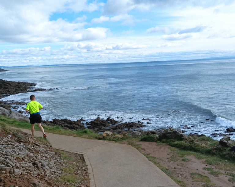 A jogger on the Gower coastal path