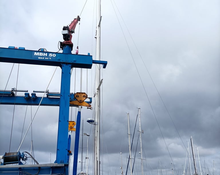 A yacht is re-masted.