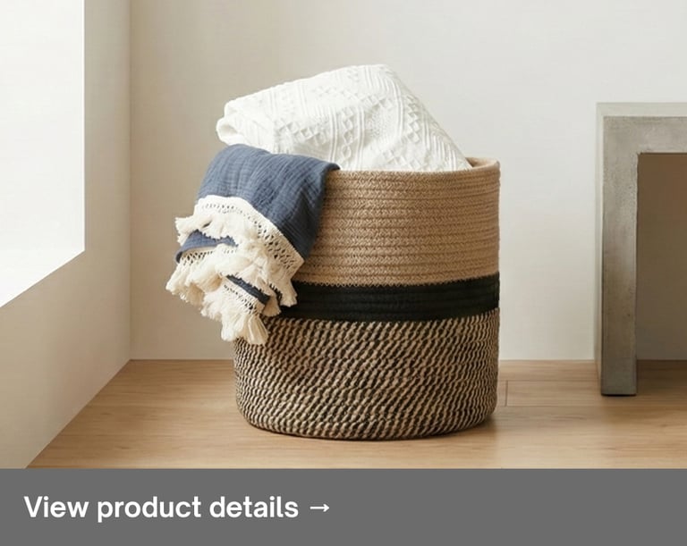 Woven storage basket with folded blankets in a bright minimalist interior