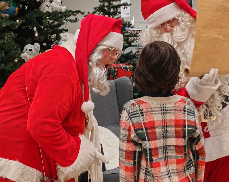 Santa Claus meeting children at Nature Dream Days Christmas Village Finland