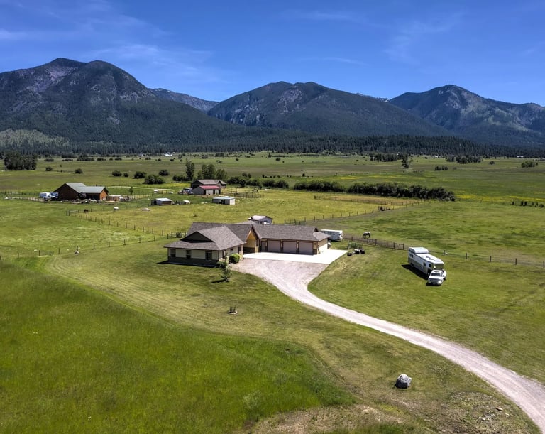 Aerial view of a Luxury montana home built next to the Mission mountains