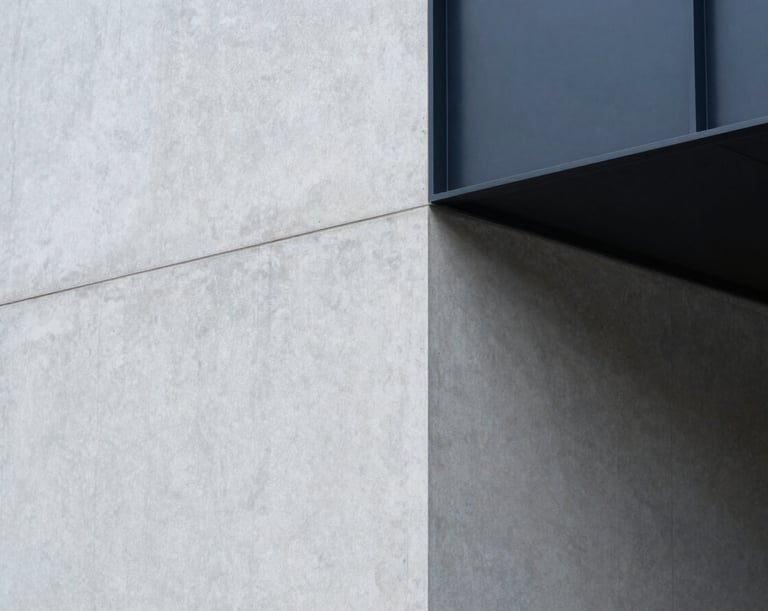 Abstract structural shadows cast on a light gray concrete wall, clean geometric lines, minimalist corporate aesthetic.