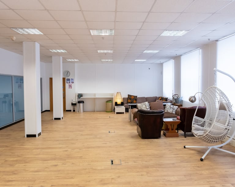The White Room at Atlas Studios. Image showing laminate flooring, clean white walls and furniture.