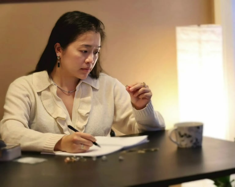 Jewelry designer sketching a custom gemstone ring design