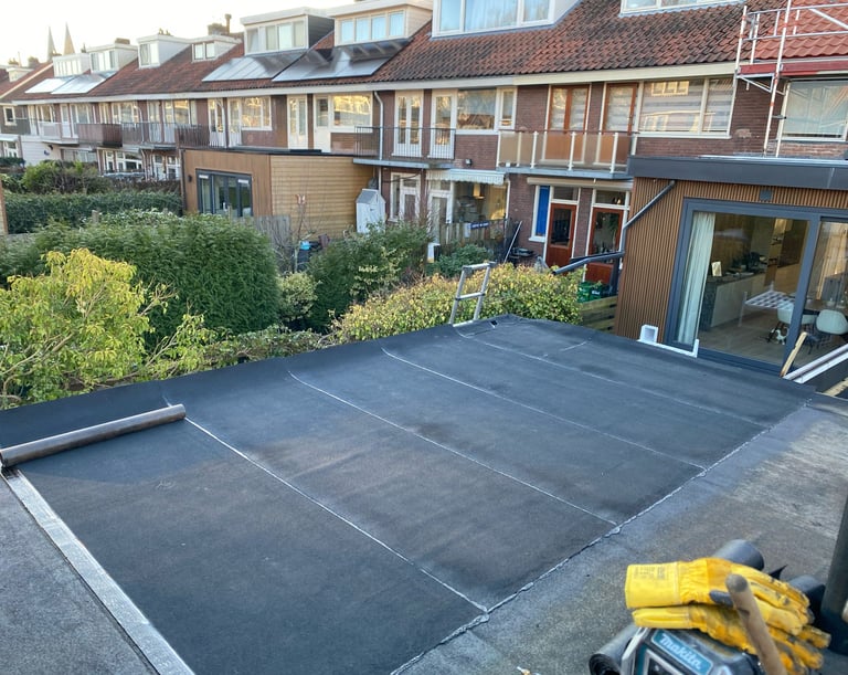 a man is working on a roof with a hammer hammer