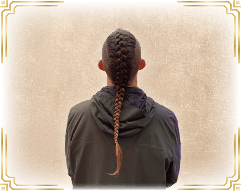 a man with a single dutch braid