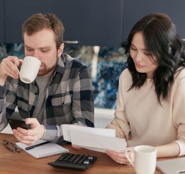 business owners reviewing expenses