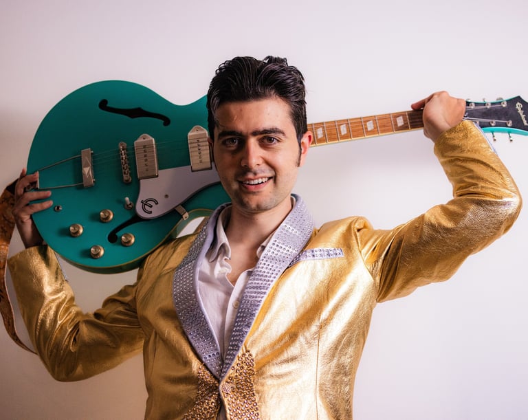 Brighton UK singer songwriter Olly Williams promotional photo with electric guitar