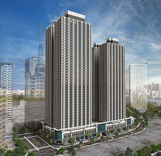 Modern twin-tower high-rise residential condominium building in a sunny urban cityscape.