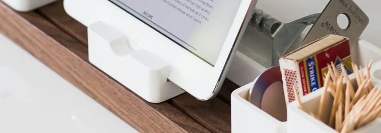 a tablet computer sitting on a counter top