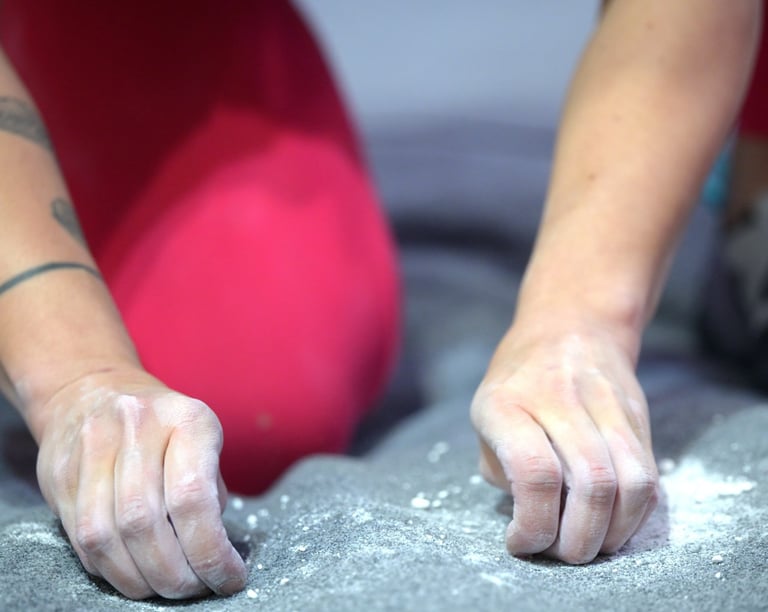 a climber is cleaning up climbing chalk