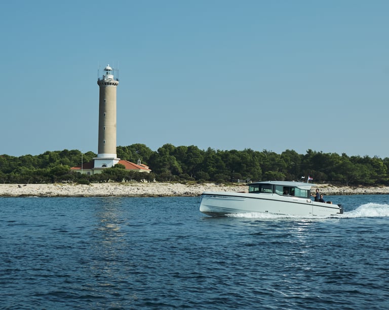 Just enjoy boat cruising the waves, passing by a lighthouse on the shore.