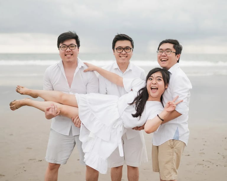 Playful multigeneration family moment at Seminyak Beach Bali captured in natural and relaxed family photography style.