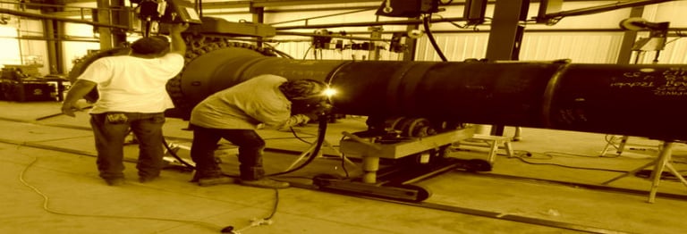 a man welding a kiln burner at Shivshakti Plant