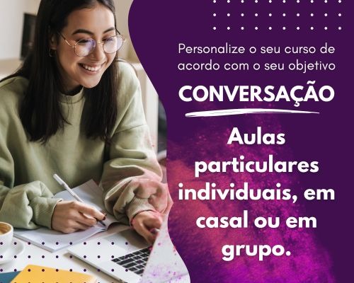 a woman sitting at a table with a laptop and a notebook