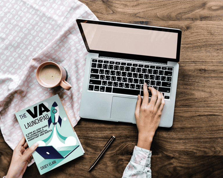 a person sitting at a desk with a book and a cup of coffee