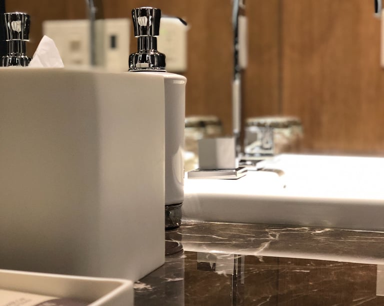 ultra modern and shiny example of renovation in bathroom showing sink and accessories