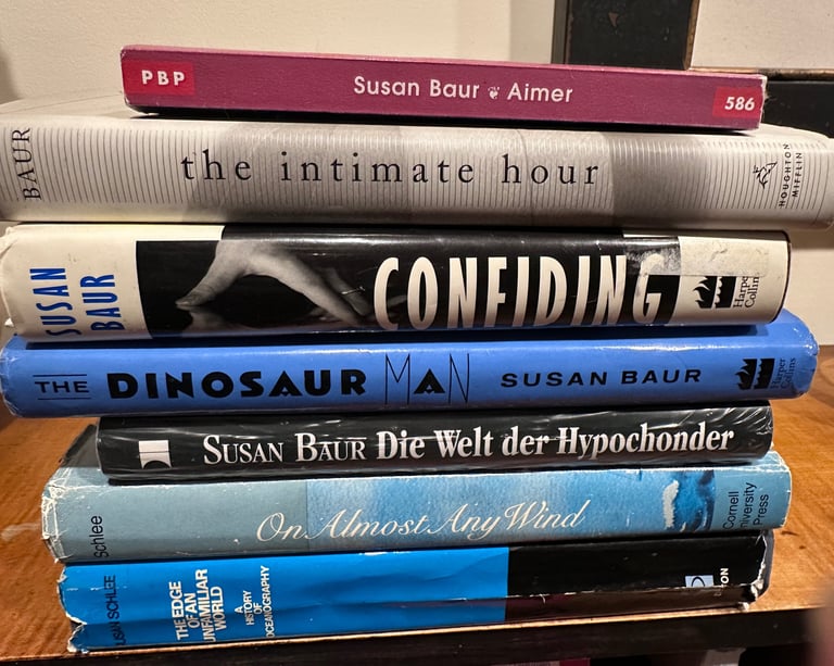 A stack of seven books authored by Susan Baur, or under the name Susan Schlee.