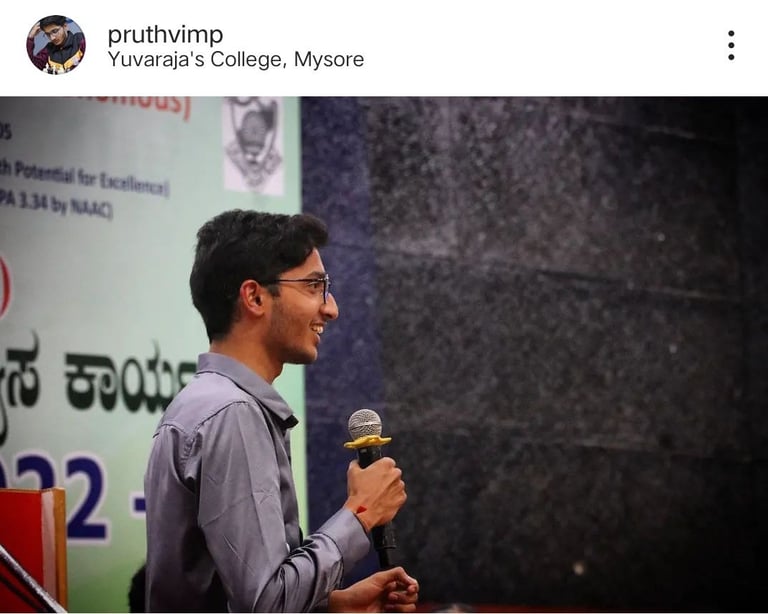 Pruthvi M P in a gray shirt and a microphone