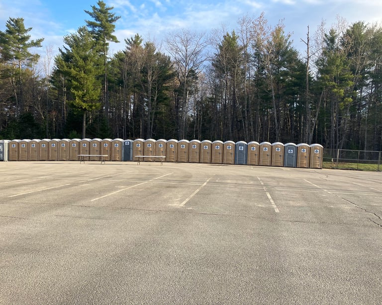portable potties in a parking lot