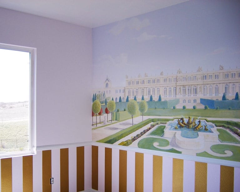 A room adorned with a mural of Versailles and gardens, gold-pink striped dado and a window.