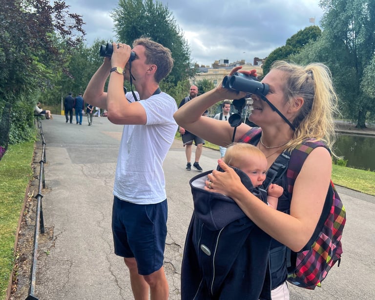 Husband, wife and baby daughter experiencing a Goldcrest - the smallest bird in the UK - at close quarters in Regent's Park.