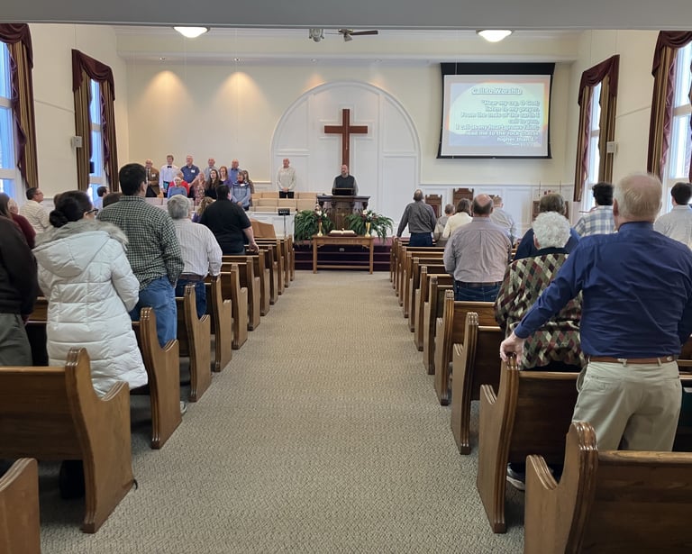 an old fashioned church filled with people singing praise to God