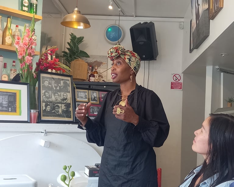 Jamila giving talk about Mangrove Nine