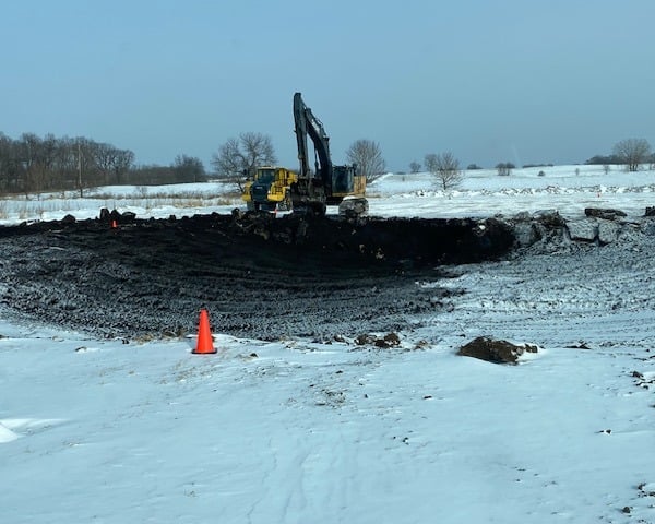 pond being excavated in the snow